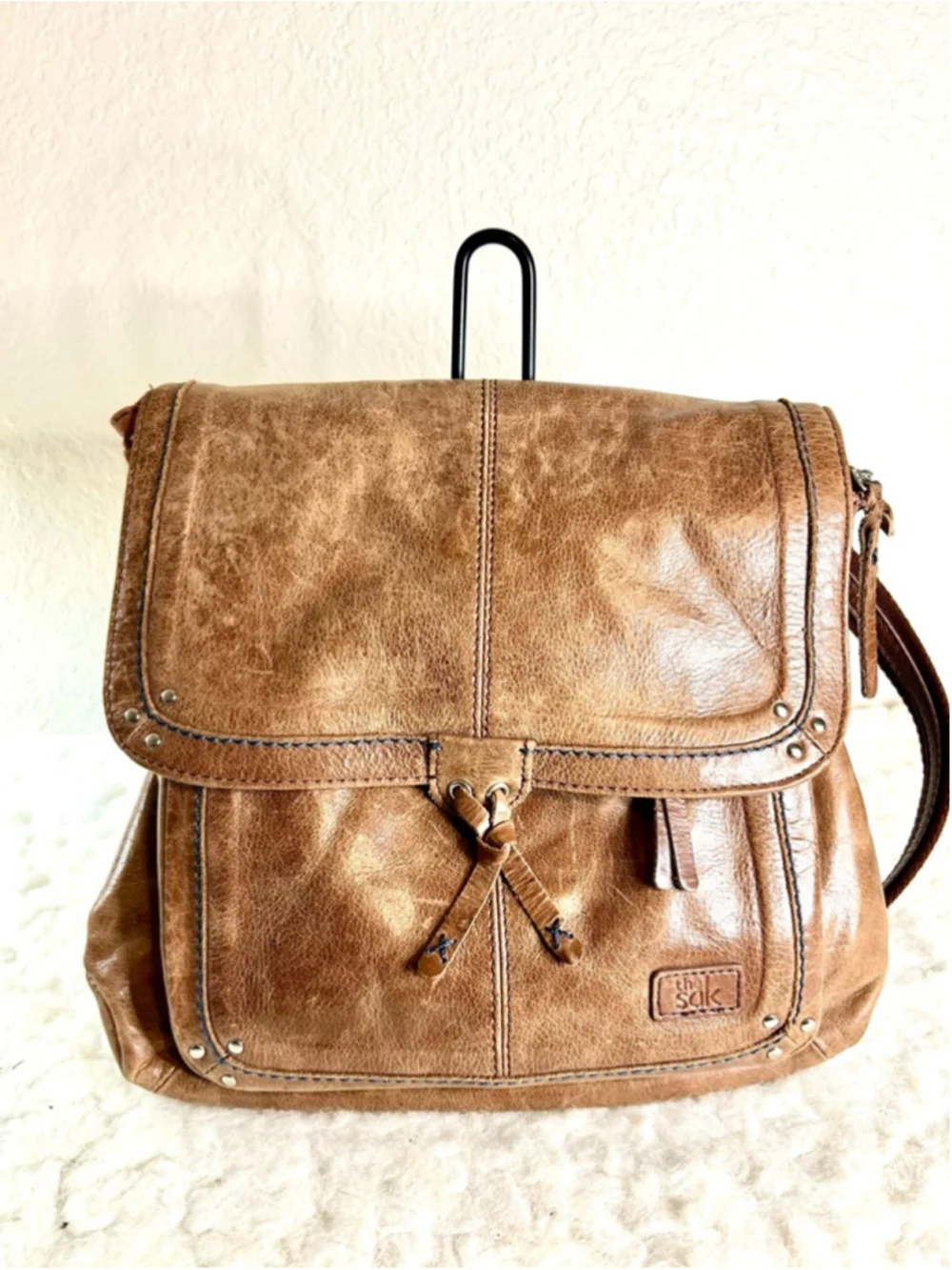 The Sak Ventura Leather Convertible Backpack in a brown, distressed leather